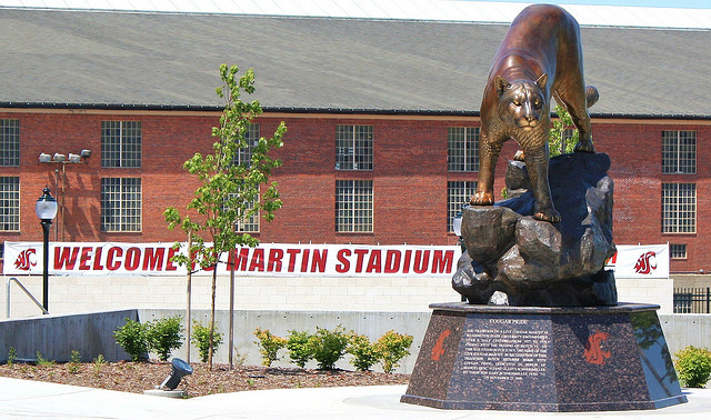 Large bronze cougar mascot sculpture at stadium entrance